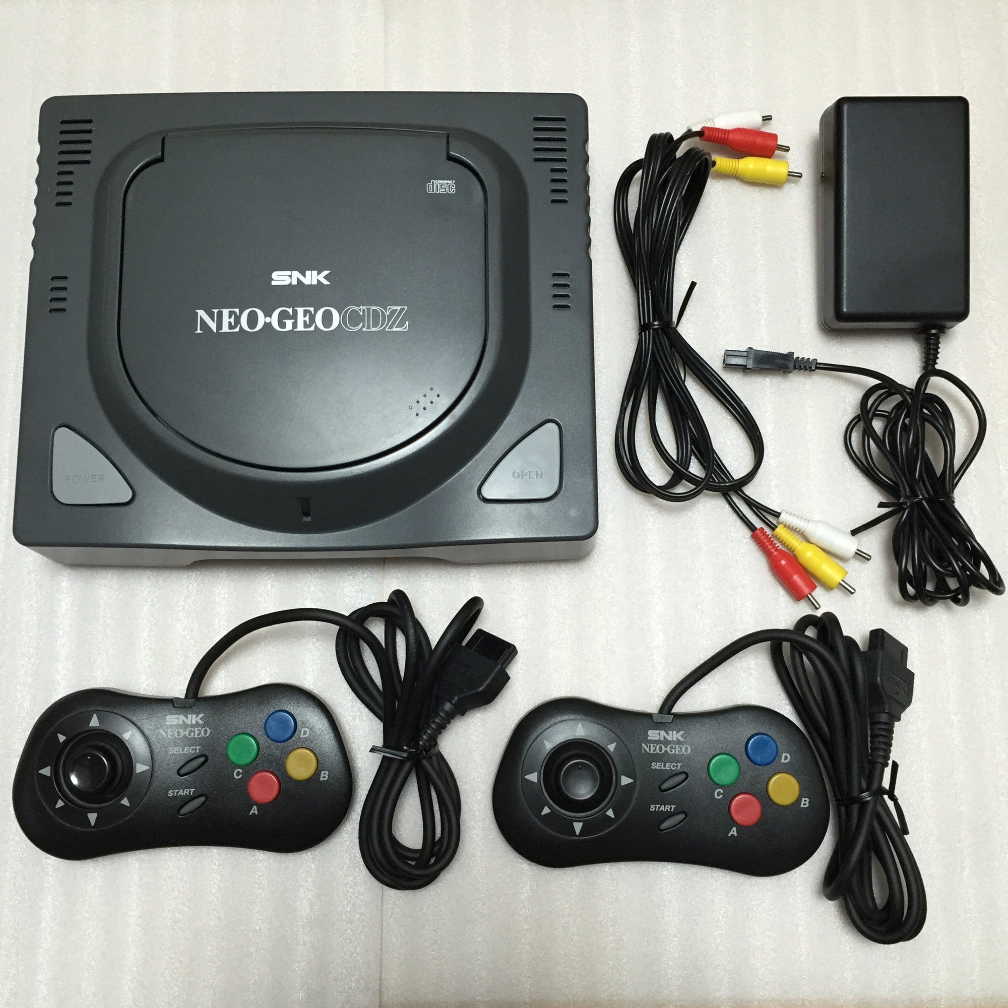 NeoGeo CDZ System + 2 Samurai Spirits games - RetroAsia - 1