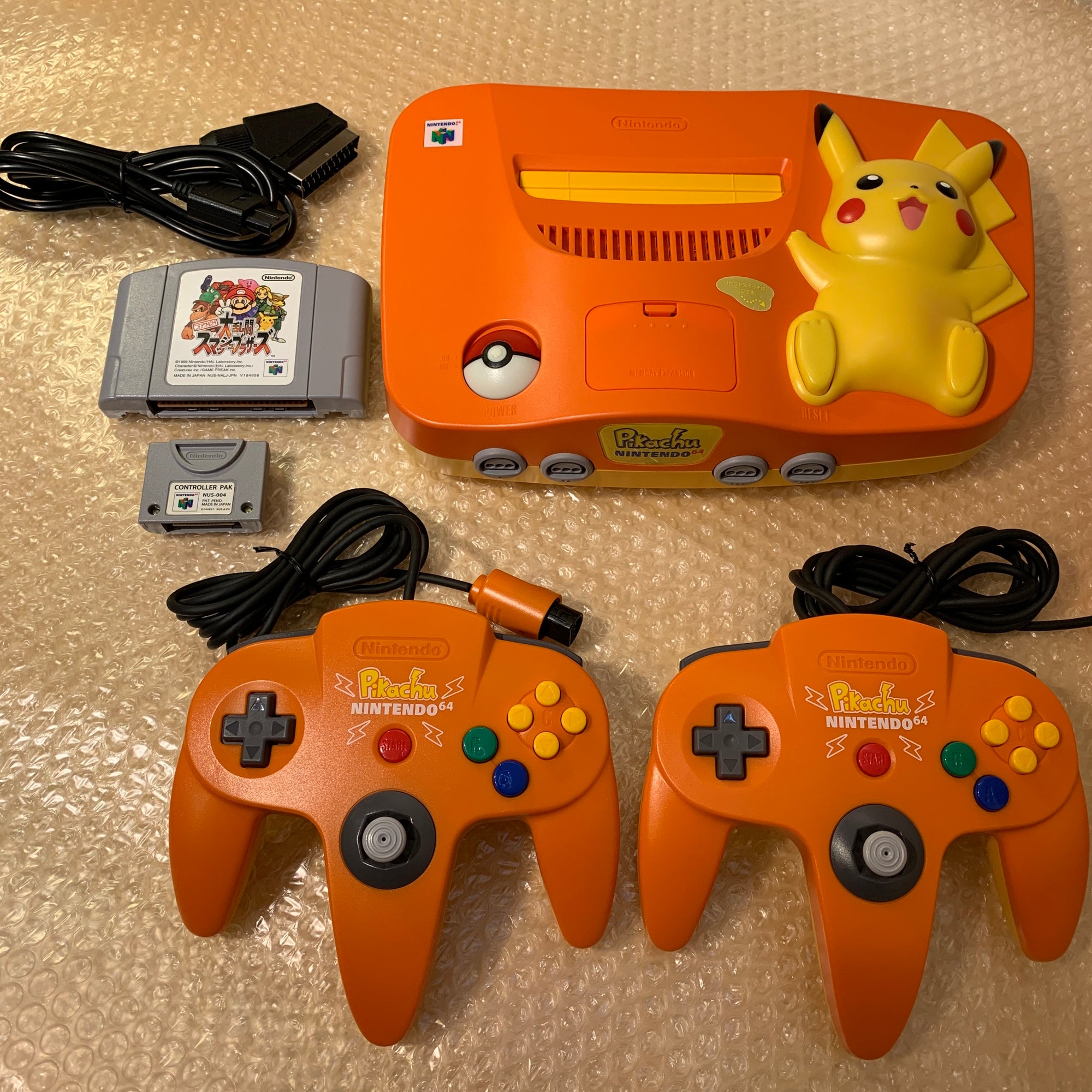 Pikachu Orange Nintendo 64 set with ULTRA HDMI (HW2 with RGB) kit - compatible with JP and US games